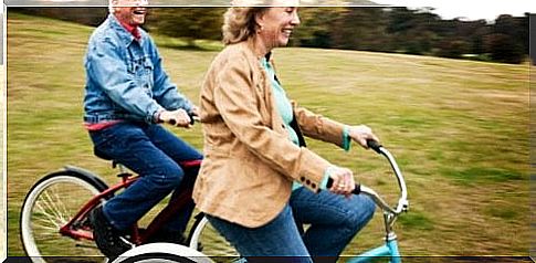 Elderly couple on bicycles