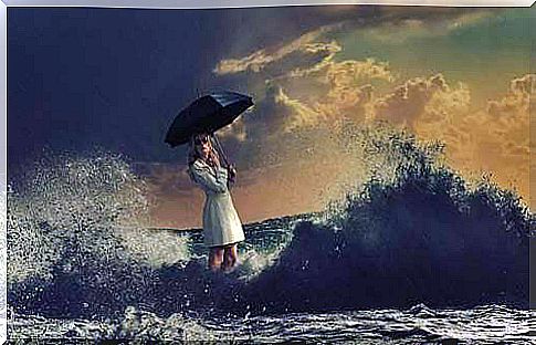 Woman at the sea with umbrella.