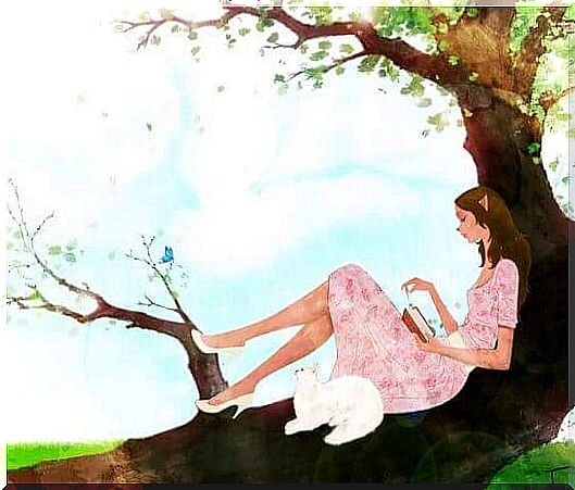 white cat and girl reading on the tree