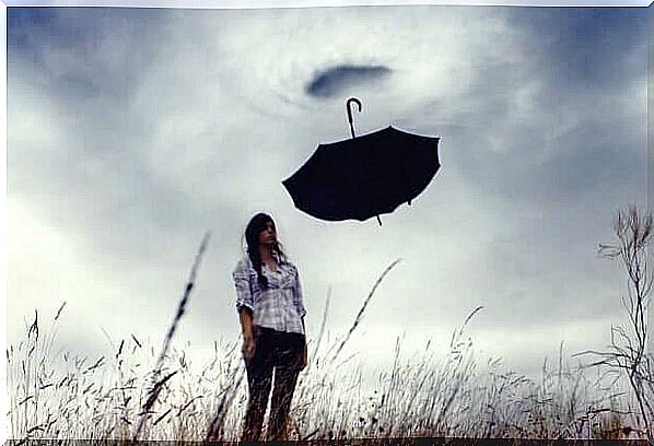 Girl with umbrella in reverse