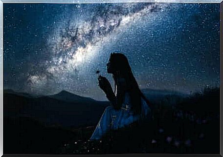 Fascinated girl under the stars.