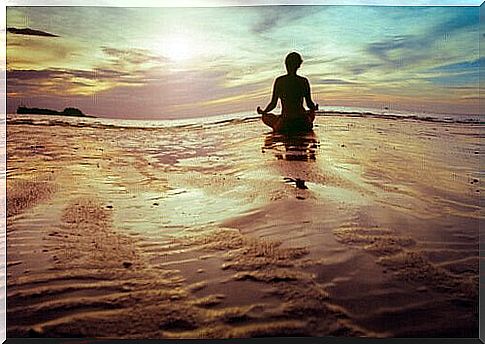 Woman from behind meditating