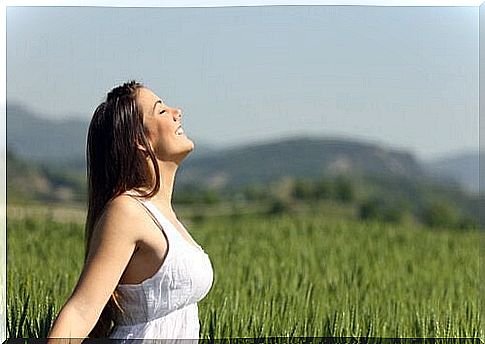 Girl smiling in a field