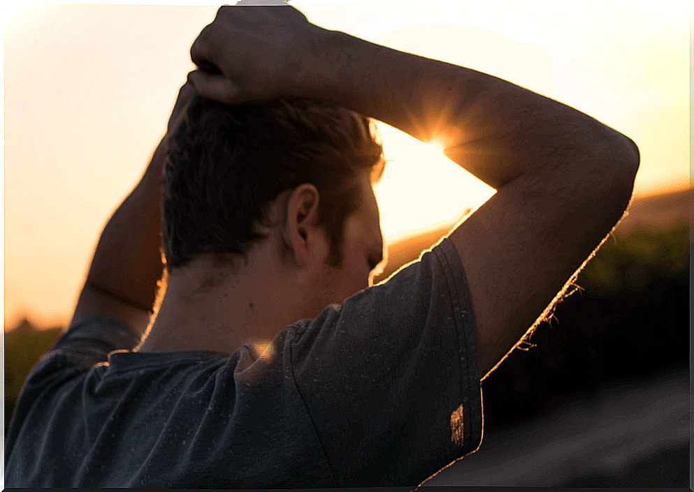 Worried man with hands on head