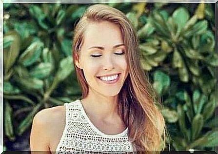 Girl practices informal meditation with closed eyes.