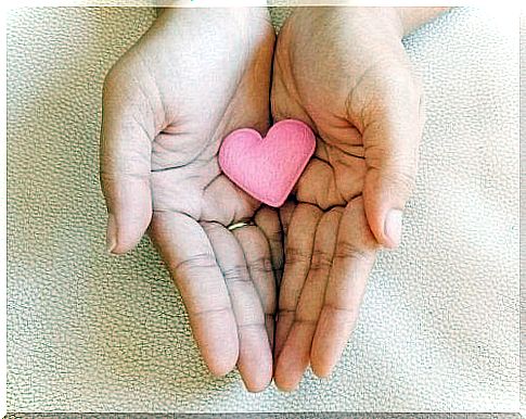 Hands supporting a heart