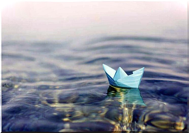 Paper boat in the water