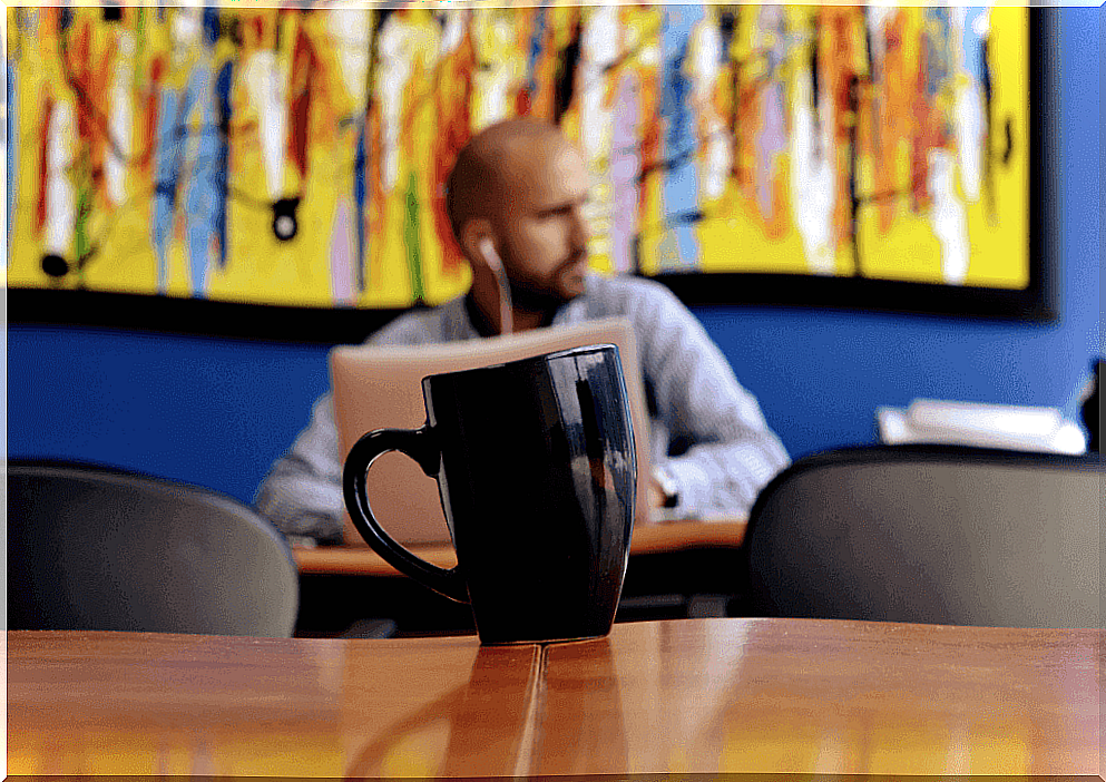 Man in a bar with headphones on