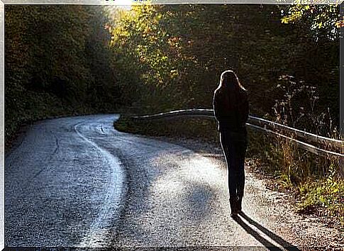 Woman walking along a path.