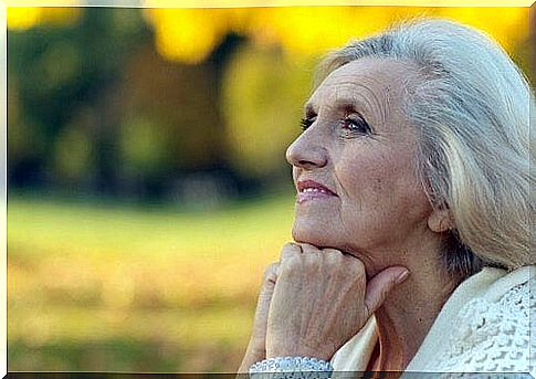 Elderly woman looking at the horizon.