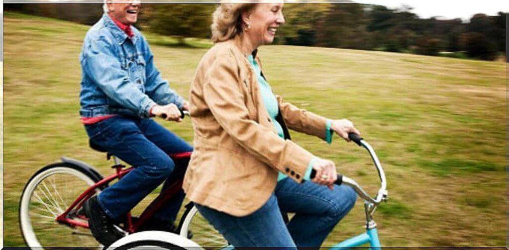 Happy elderly people on bicycles