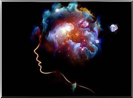 Universe of colors in the mind of a woman in profile.