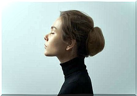 Woman in profile with closed eyes and wandering mind.