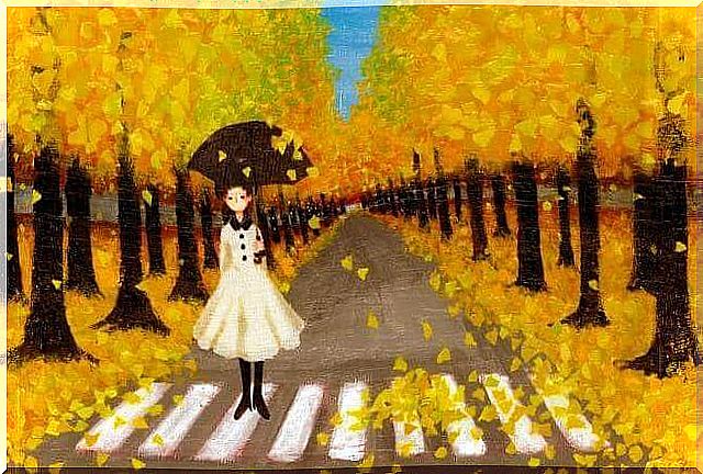 girl among yellow leaves